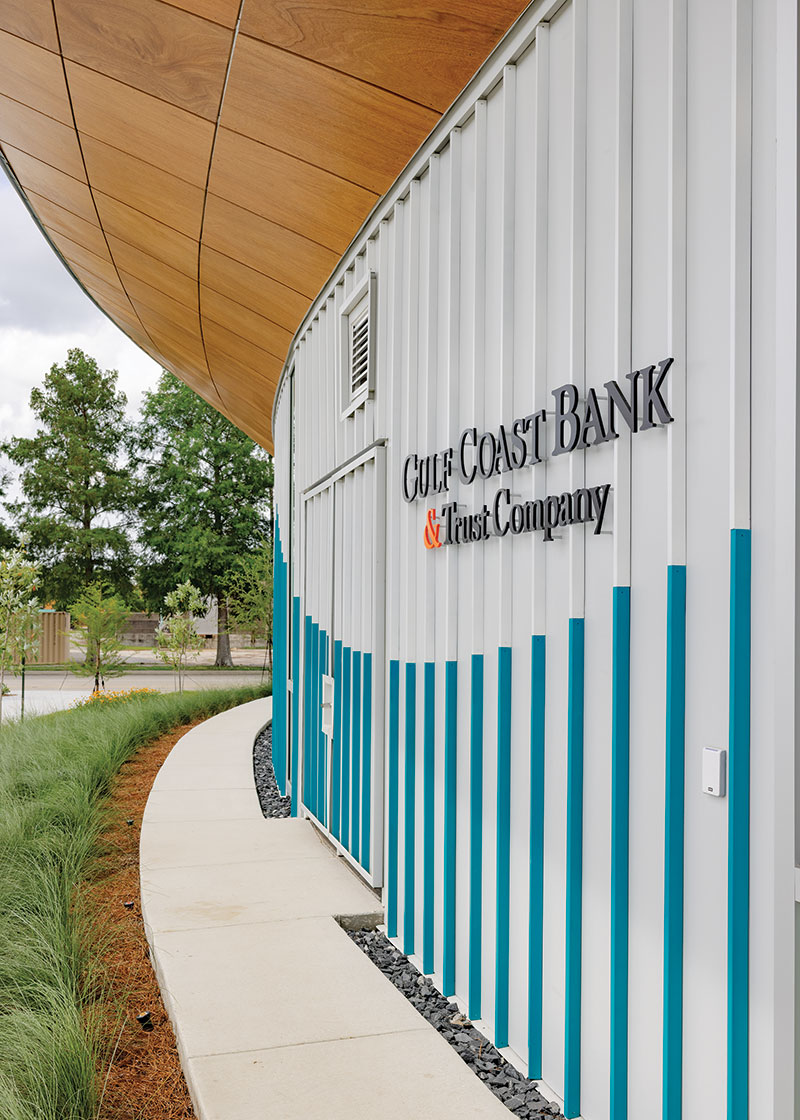 Closer image of the sign that says "Gulf Coast Bank & Trust Company" on the exterior of the building.