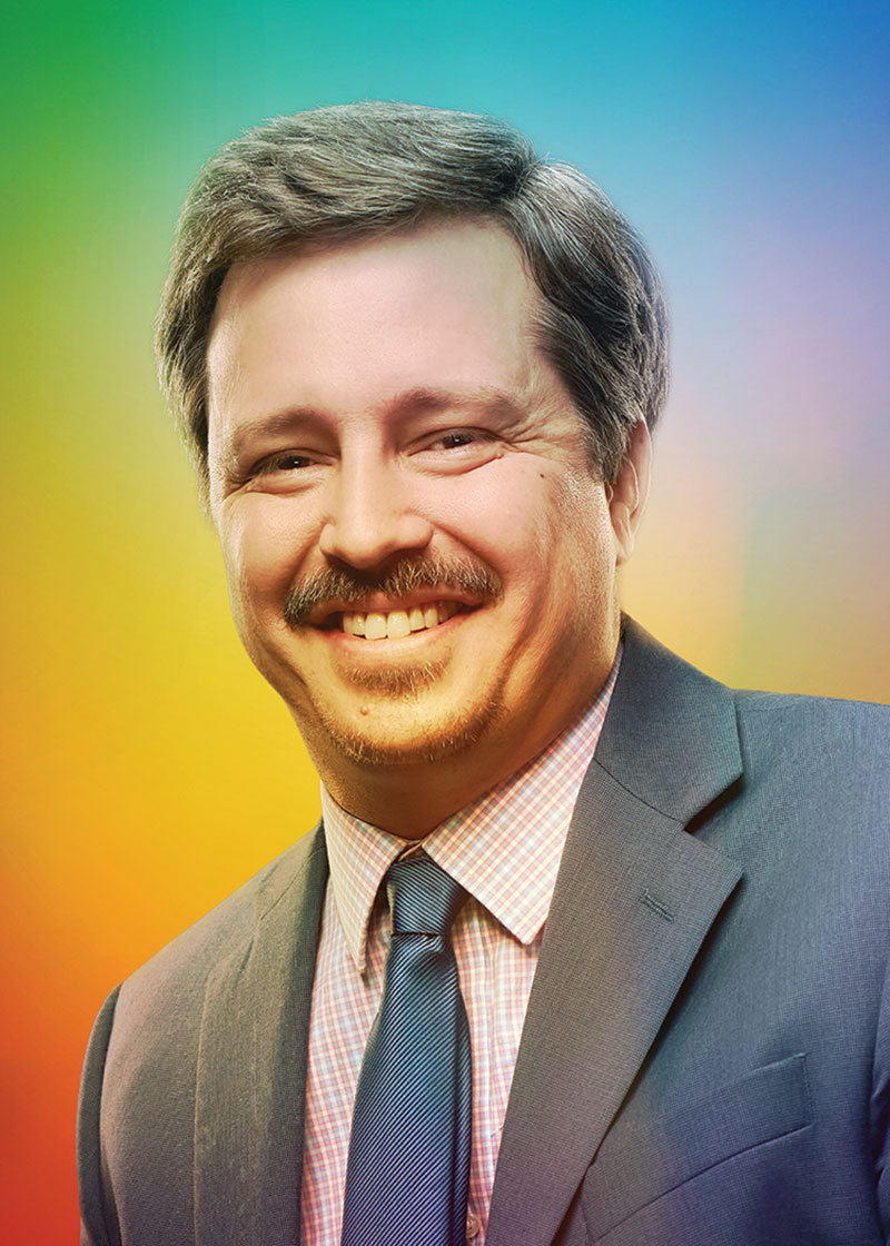 Closer photo of Knudsen (chest up). Knudsen is smiling and looking into the camera.