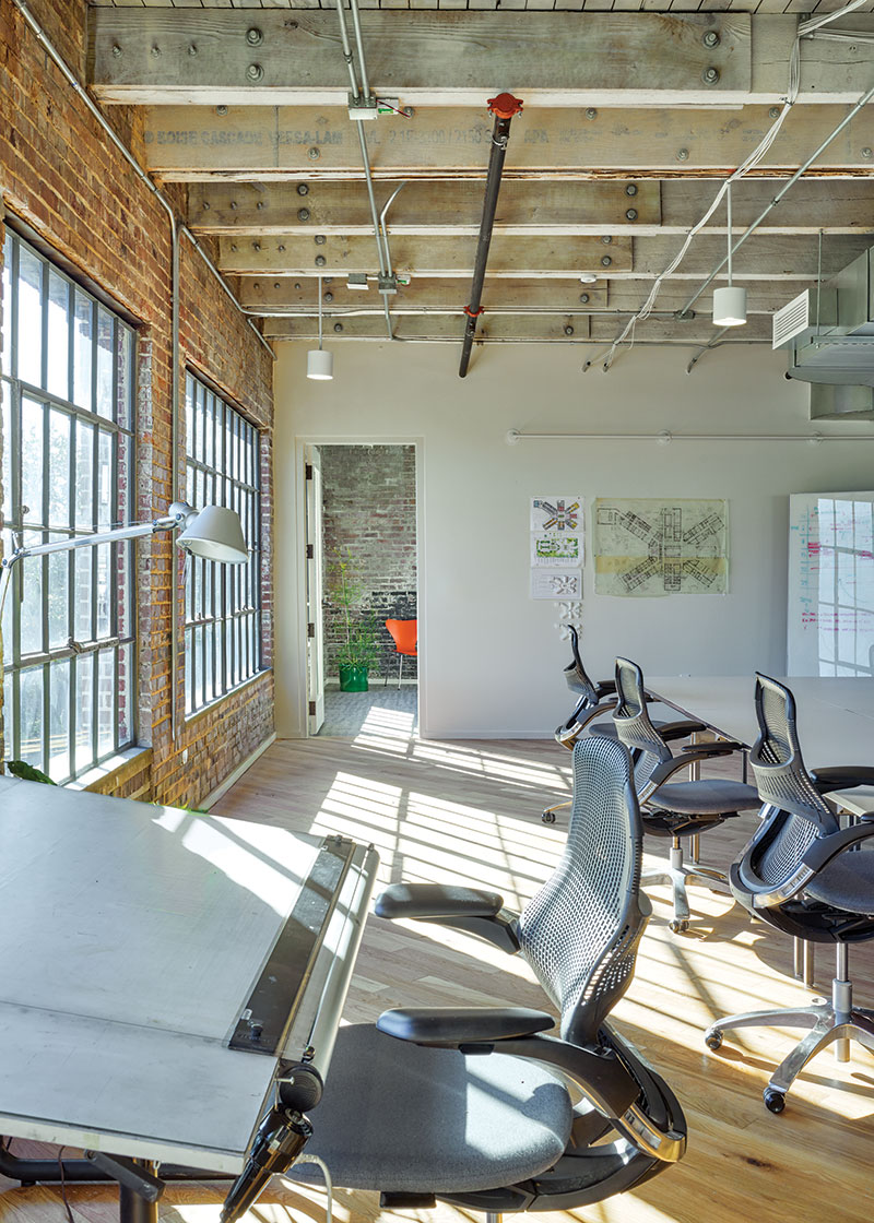 Straightforward shot of the left side of the office, looking into another room