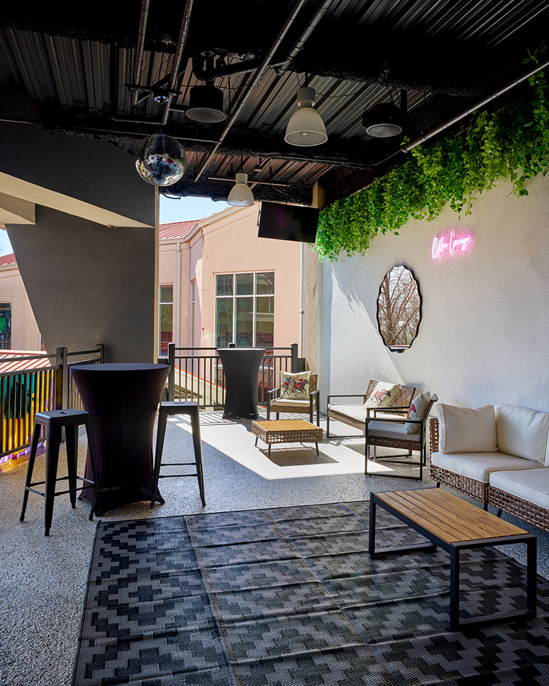 Interior of the Ultra Lounge featuring new furniture and high top tables