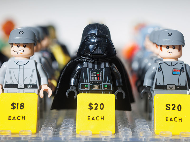 Three rows of Star Wars-themed Lego minifigs for sale 