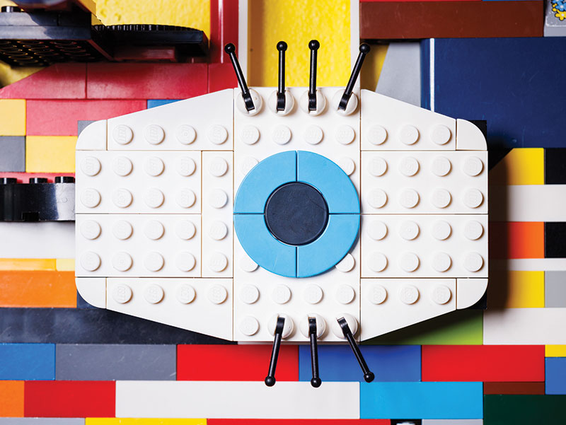 Lego pieces arranged to look like a large blue eye staring