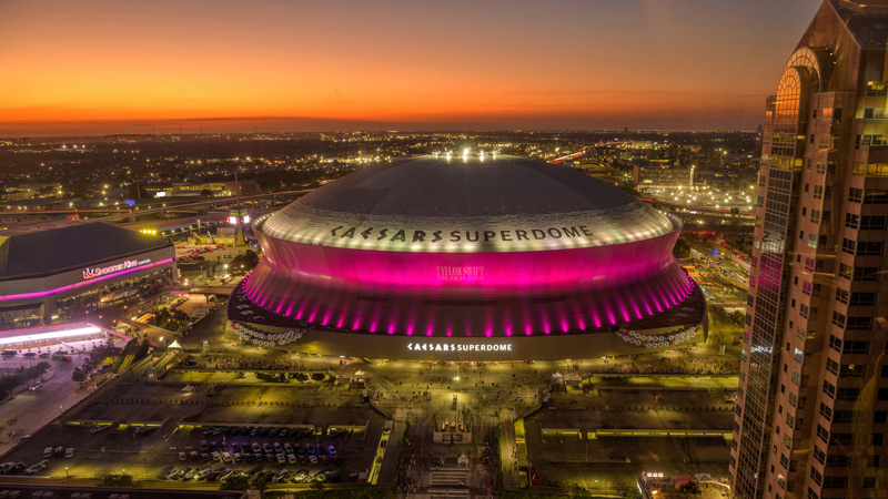 Saints Image of the Caesar's Superdome in the sunset. The Superdome lights are a bright pink.