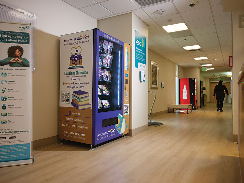 An angled view of the vending machine from a little down the hallway