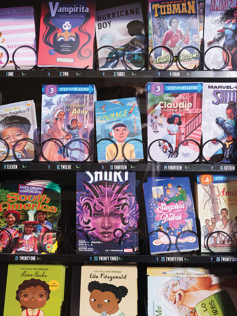 Close up of the books inside the machine, featuring titles from Step into Reading, and more
