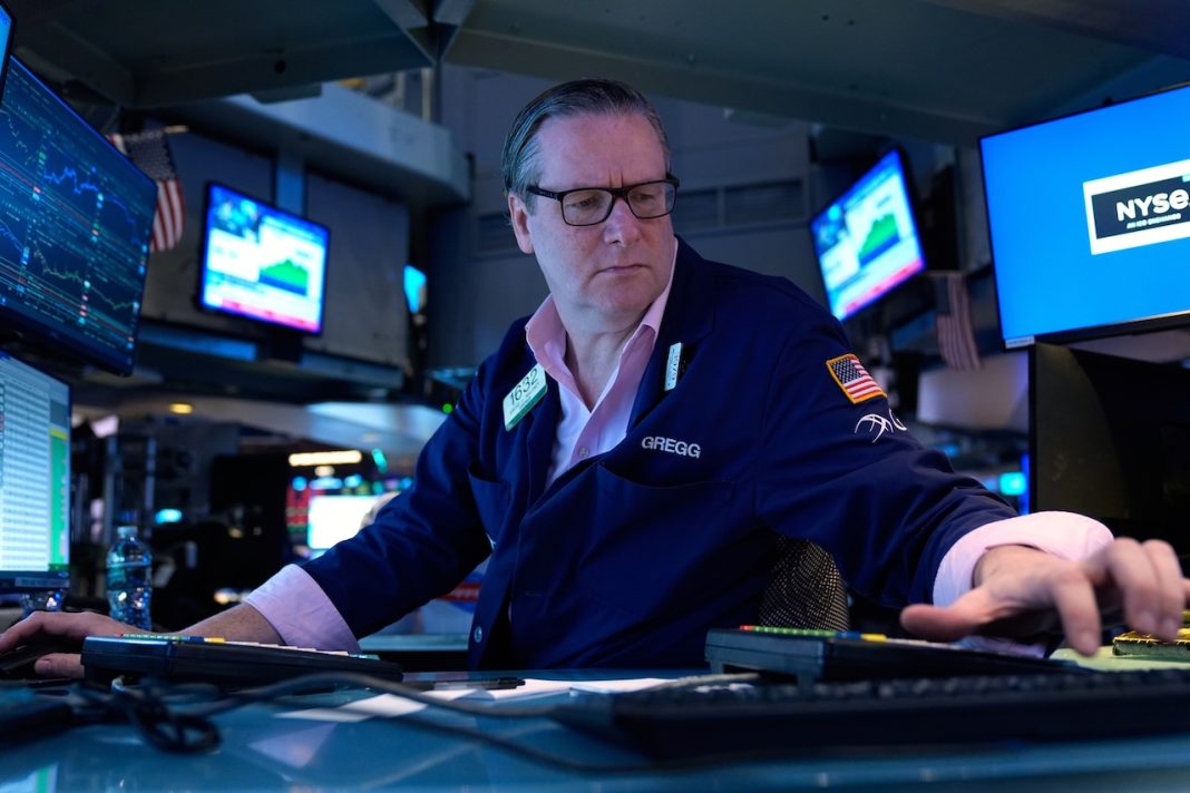 Oil jumps to $100 per barrel and stocks sink worldwide